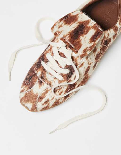 ASOS DESIGN retro sneakers in faux pony print with oversized tongue