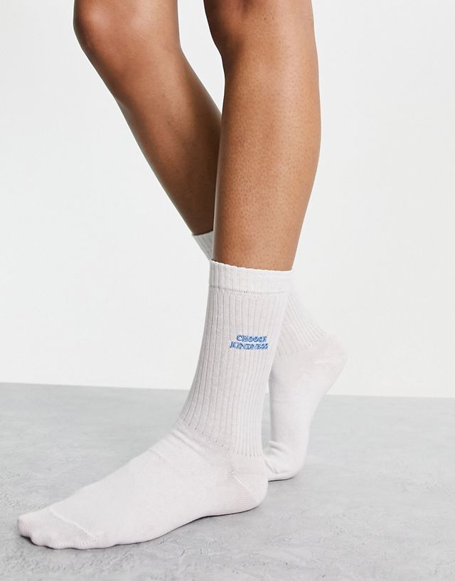 ASOS DESIGN socks with choose kindness embroidery slogan in off white