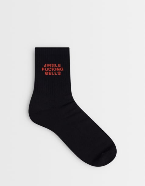 ASOS DESIGN socks with Christmas swear word graphic in black - view 1