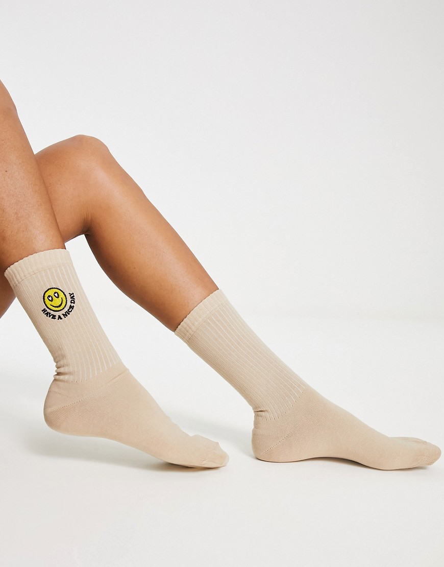 ASOS DESIGN socks with happy face embroidery in beige-White