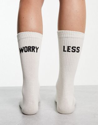 ASOS DESIGN socks with worry less slogan in off white - WHITE