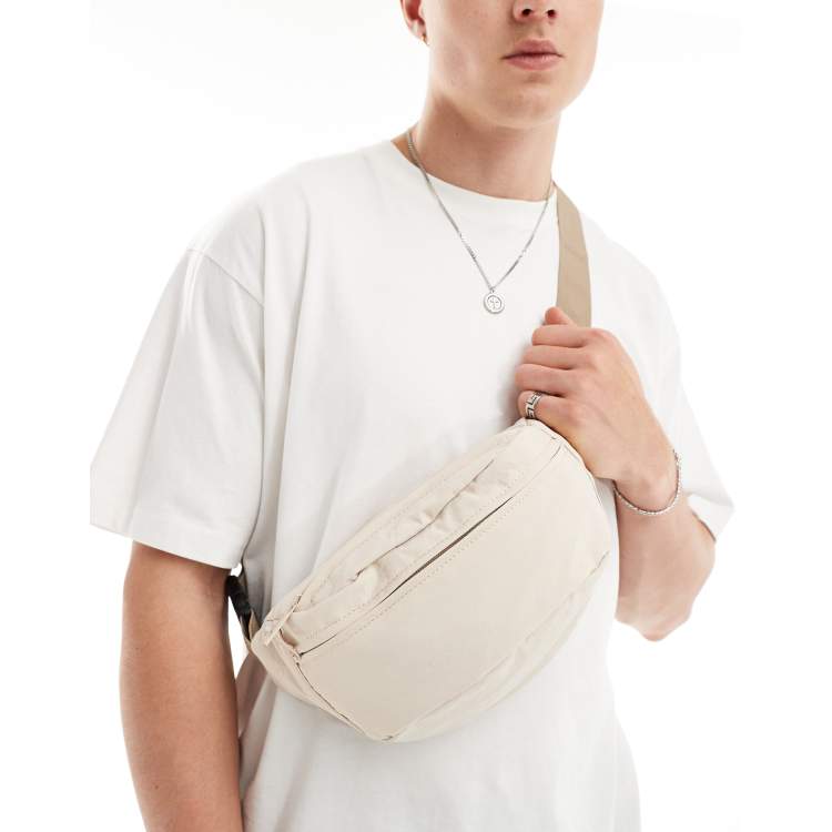 ASOS DESIGN soft cross body bum bag with multiple compartments in ecru and stone ASOS