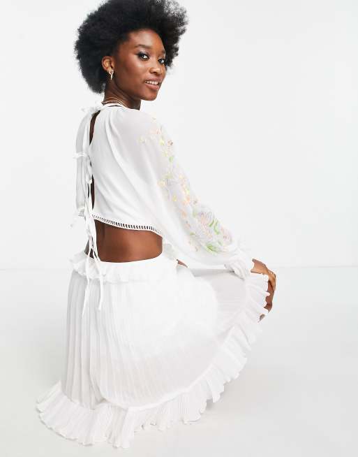 ASOS DESIGN soft cut out side pleated mini dress with embroidery in white |  ASOS
