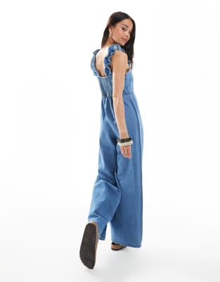 Asos Design Soft Denim Jumpsuit With Frill Straps In Blue