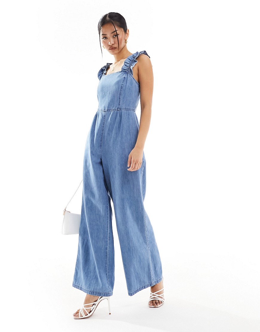 Asos Design Soft Denim Jumpsuit With Frill Straps In Mid Blue