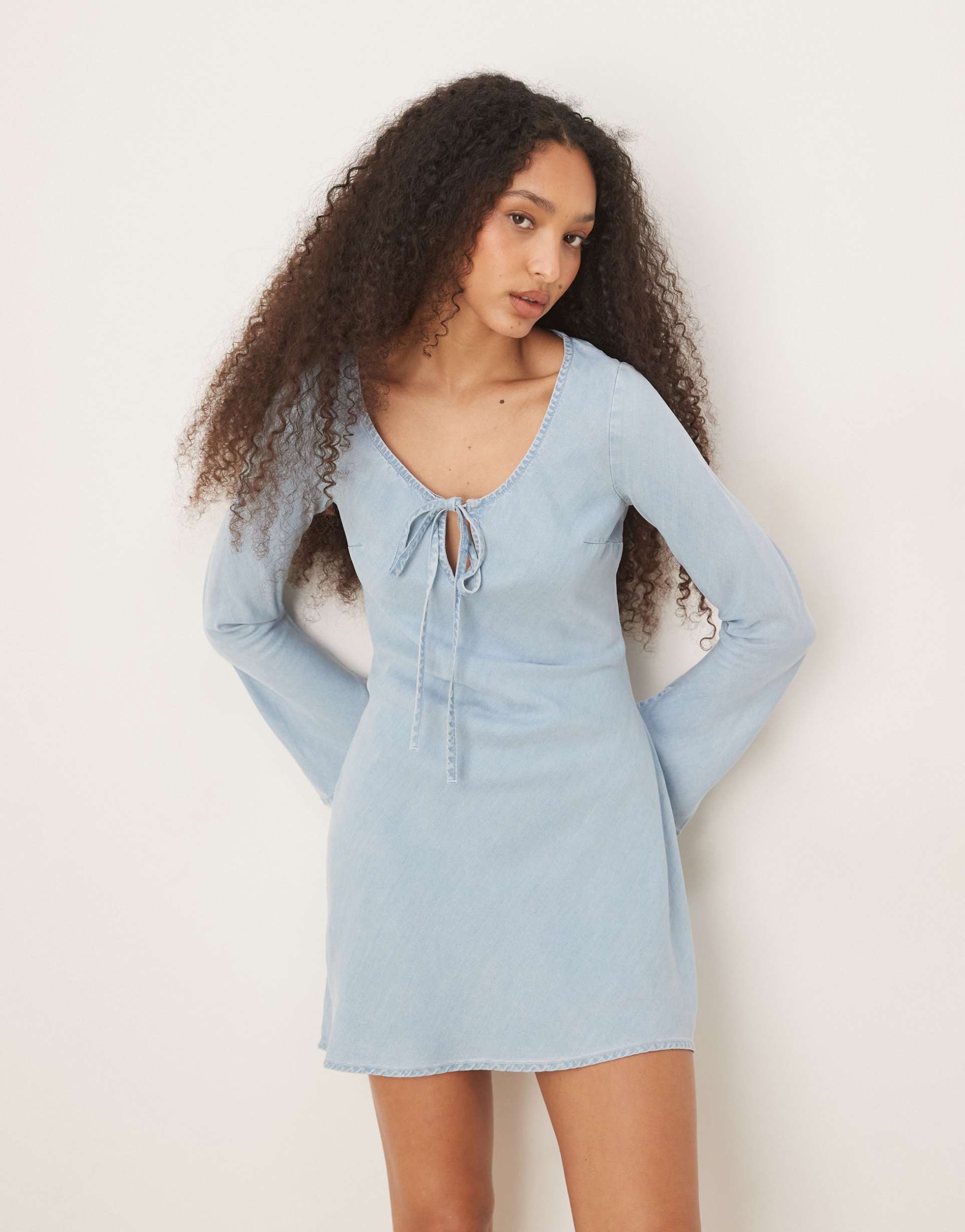 asos design soft denim mini dress with bow front detail in light blue