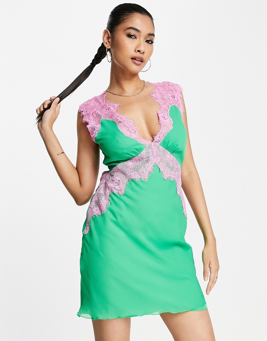 ASOS DESIGN soft slip mini dress with contrast lace and tie back detail in green and pink