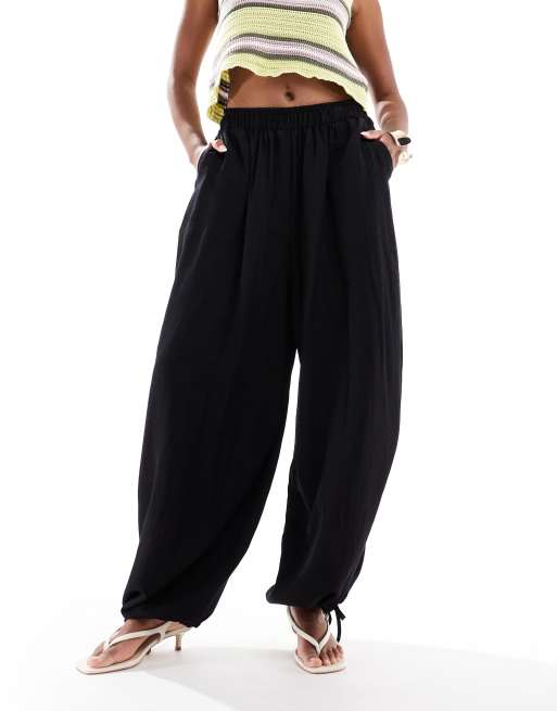 ASOS DESIGN soft textured oversized billow trousers with tie hem in black, 2 of 5