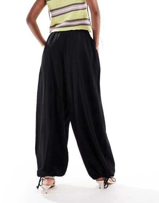 ASOS DESIGN soft textured oversized billow trousers with tie hem in black, 3 of 5