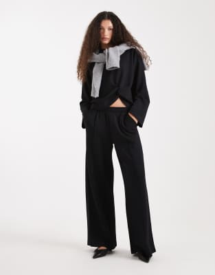 ASOS DESIGN soft touch cupro wide leg sweatpants in black