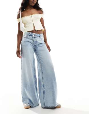 ASOS DESIGN soft wide leg jeans with cross front in light wash blue