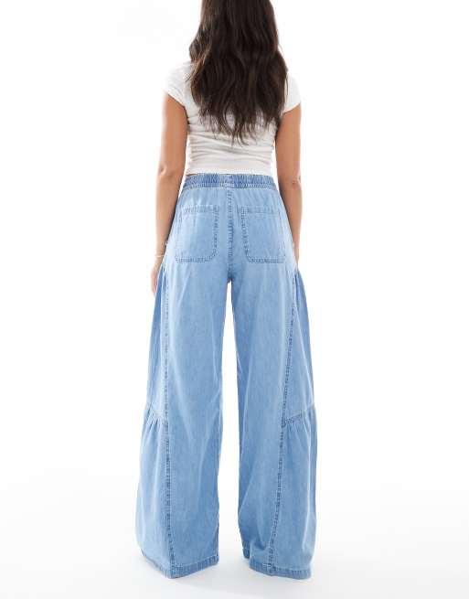 ASOS DESIGN soft wide leg pull on jeans with stitch details in mid blue