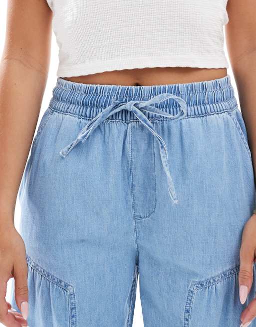 ASOS DESIGN soft wide leg pull on jeans with stitch details in mid blue