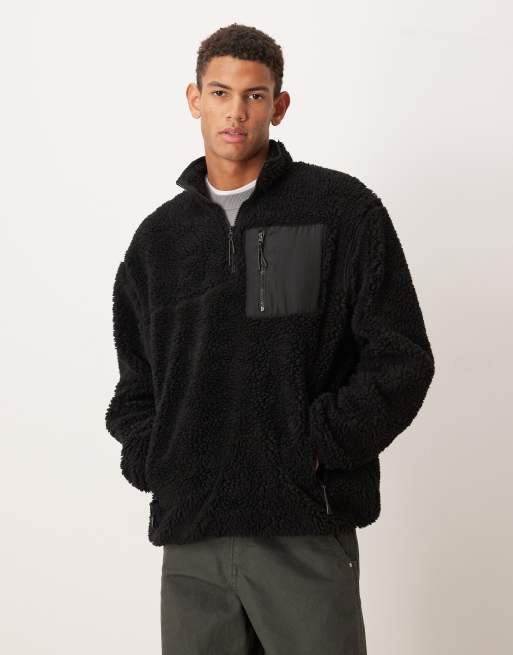 ASOS DESIGN - Sort afslappet trøje med kvart lynlås og lomme i imiteret lammeskind