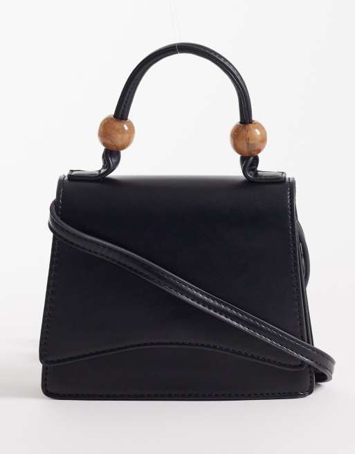 ASOS DESIGN - Sort crossbody-taske med aftagelige rem, hank øverst og kugler i resin