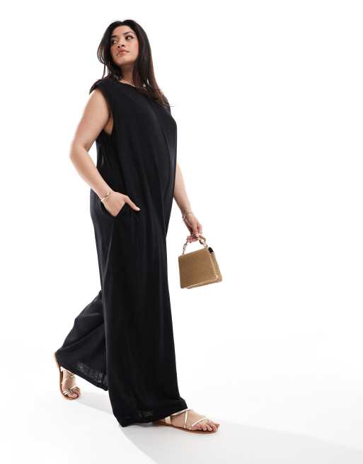 ASOS DESIGN - Sort jumpsuit med søjlesnit, brede ben og skulderpuder
