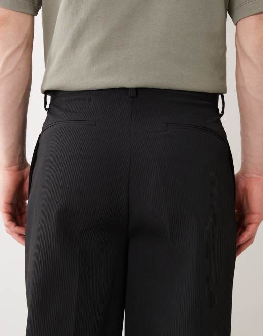 ASOS DESIGN - Sort skræddersyede tapered bukser med oversized pasform og comfort-stretch i ribstrik, 4 af 5