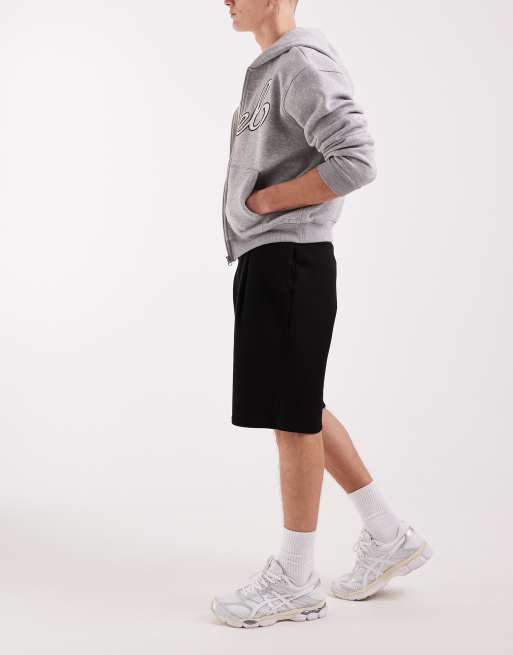 ASOS DESIGN - Sort sæt med oversized shorts og sweatshirt-tanktop med rå kanter