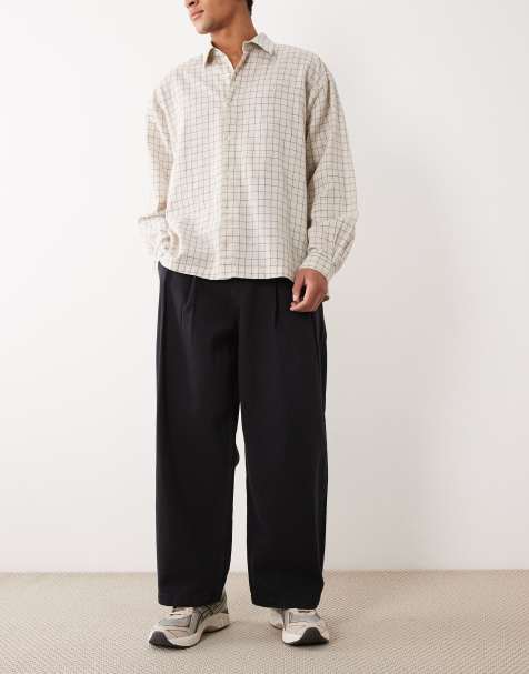 ASOS DESIGN - Sorte bukser med tøndeformede ben og plisseringer - view 1