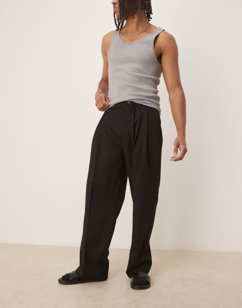 ASOS DESIGN - Sorte elegante bukser med vide ben, smalt bælte, dobbelte plisseringer og elastisk talje - view 1