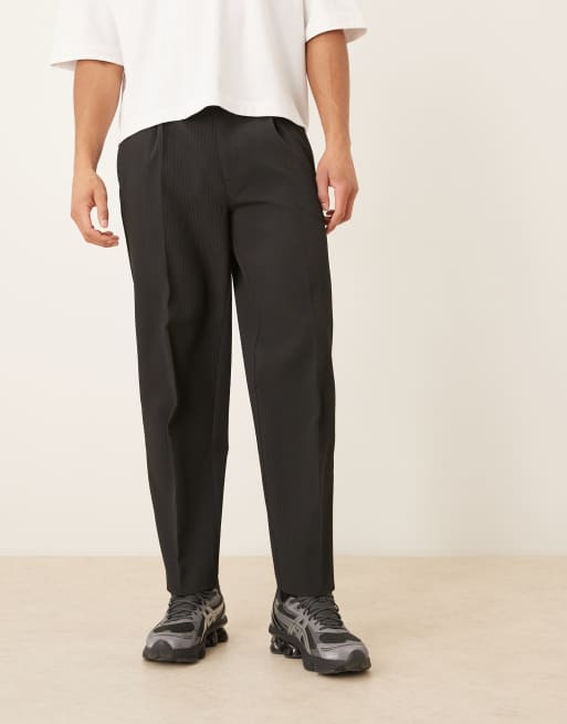 ASOS DESIGN - Sorte elegante tapered bukser med oversized pasform og plisseringer i tekstureret stof