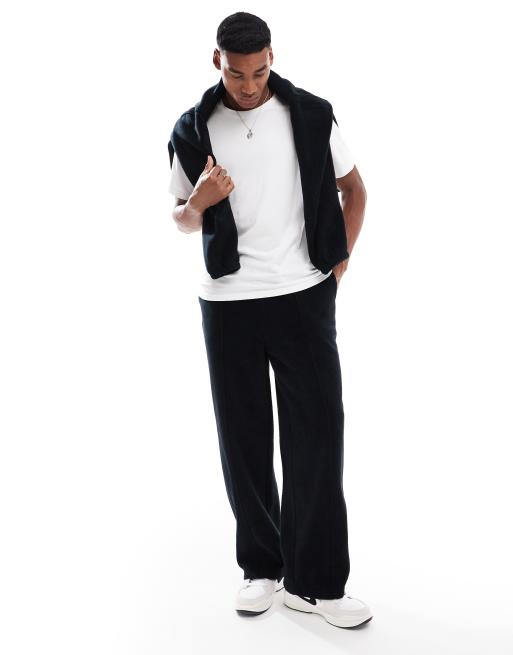 ASOS DESIGN - Sorte fleece-joggingbukser med brede ben