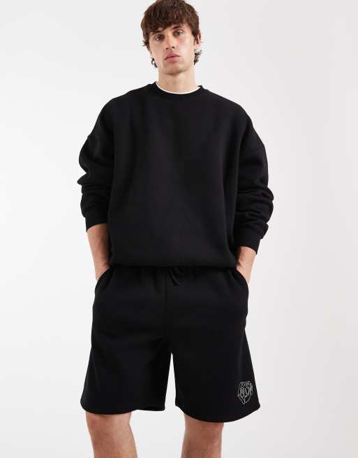ASOS DESIGN - Sorte oversized jerseyshorts med grafik