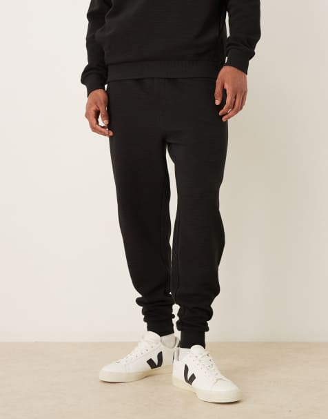 ASOS DESIGN - Sorte ribstrikkede tapered joggingbukser med tætsiddende buksekanter - Del af sæt - view 1