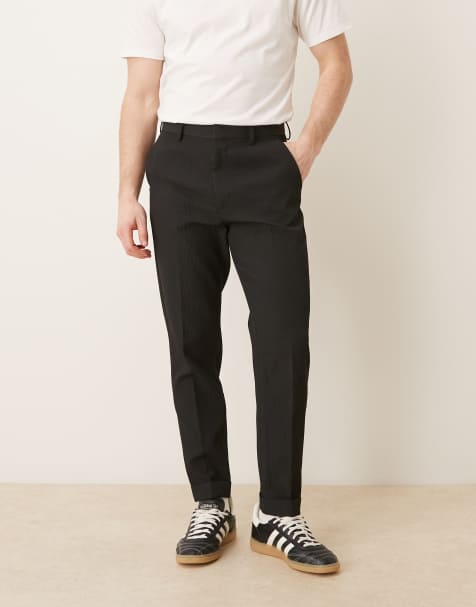 ASOS DESIGN - Sorte skræddersyede tapered bukser med opsmøg i behageligt ribstrik - view 1