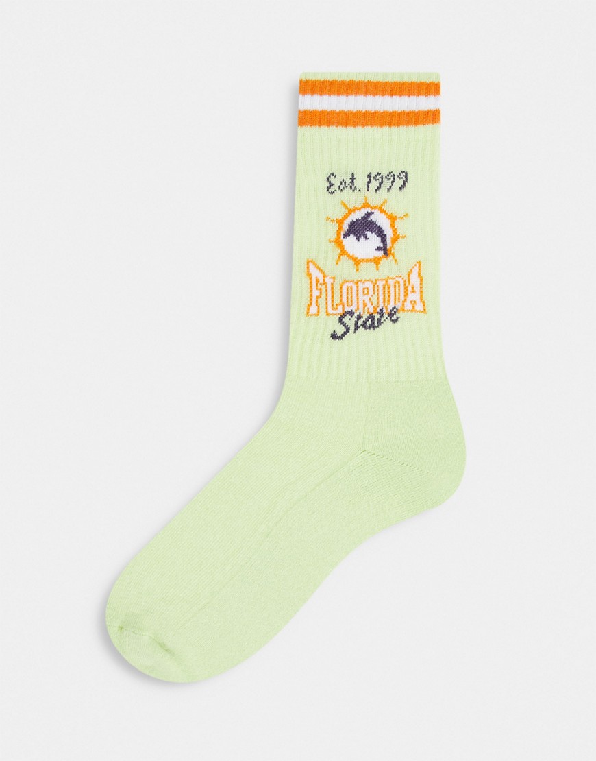 ASOS DESIGN sport socks in green with Florida State print