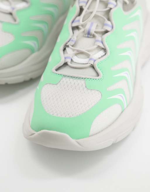 ASOS DESIGN Sportieve sneakers in grijs met groene panelen ASOS
