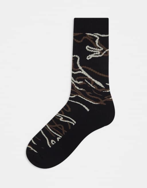 ASOS DESIGN sports socks in black with camo line design
