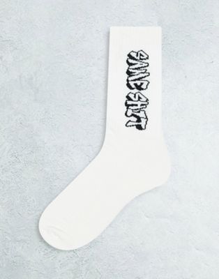 ASOS DESIGN sports socks with same shit graffiti design