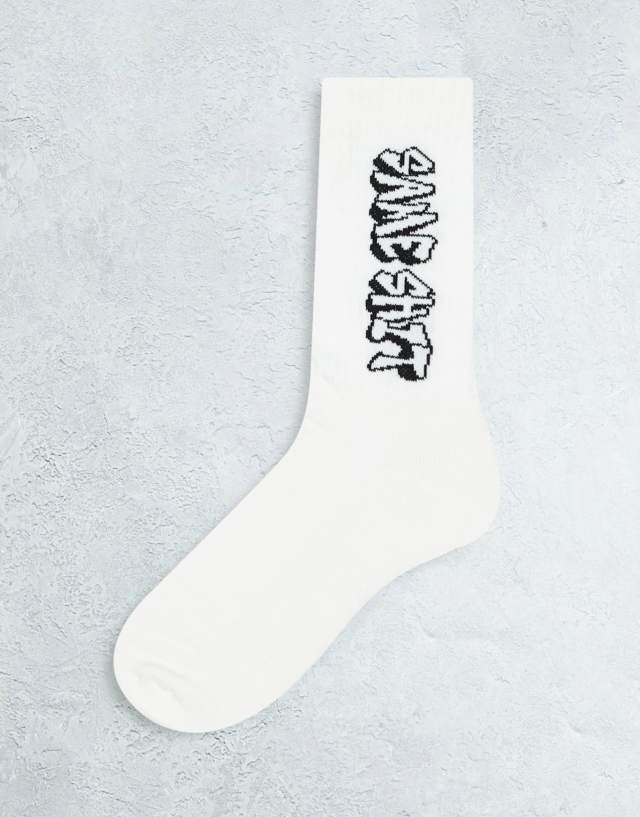 ASOS DESIGN sports socks with same shit graffiti design