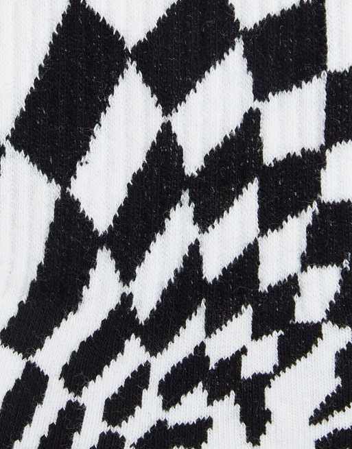 ASOS DESIGN sports socks with swirl check print in black and white, 3 of 4