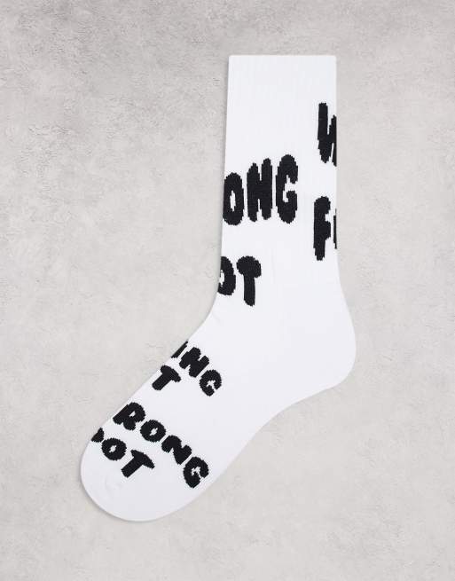 ASOS DESIGN sports socks with wrong foot slogan