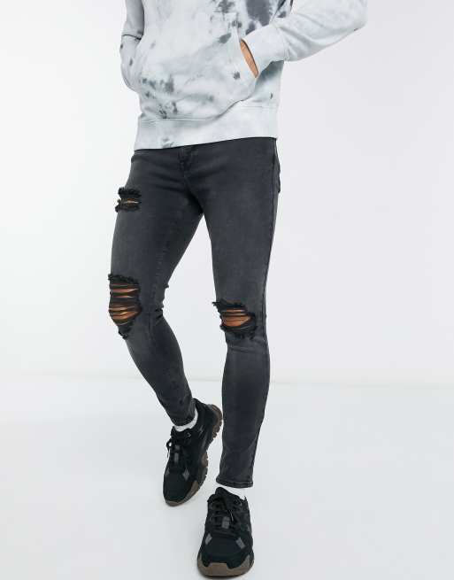 ASOS DESIGN – Spray-on-Jeans aus Power-Stretch in verwaschenem Schwarz mit Rissen an den Oberschenkeln Abnutzungseffekten