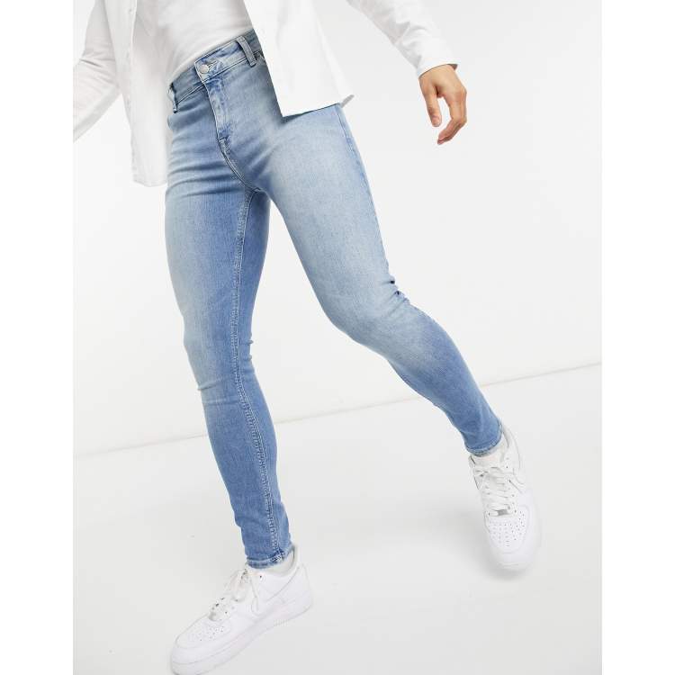 ASOS DESIGN spray on denim shorts in power stretch mid wash