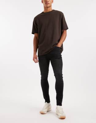 ASOS DESIGN spray on jeans in power stretch denim in washed black