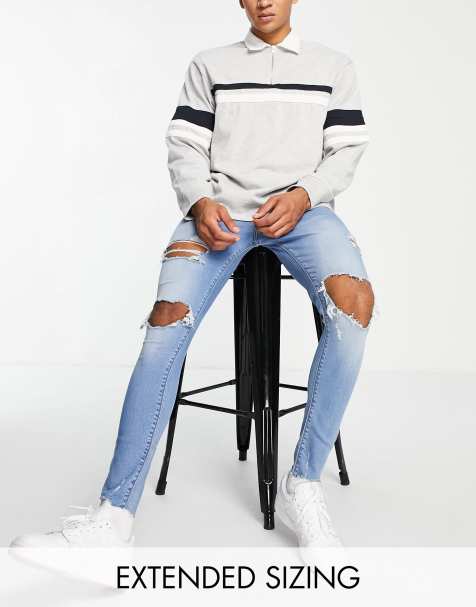 ASOS DESIGN spray on jeans in power stretch in mid wash with heavy rips