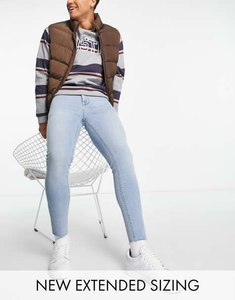 ASOS DESIGN spray on jeans in power stretch in mid wash with raw hem - view 1