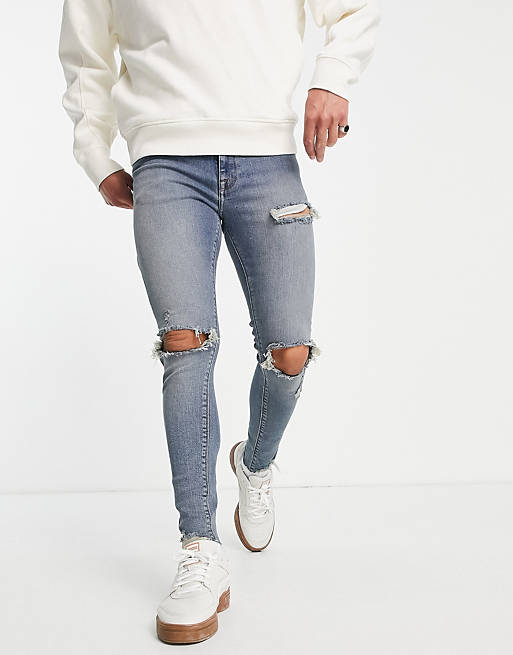 ASOS Herren Kleidung Hosen & Jeans Jeans Stretch Jeans Spray on jeans with power stretch in washed with knee rips 