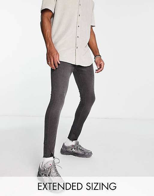 Spray on jeans in power stretch in washed with ripped hem detail Asos Men Clothing Jeans Stretch Jeans 