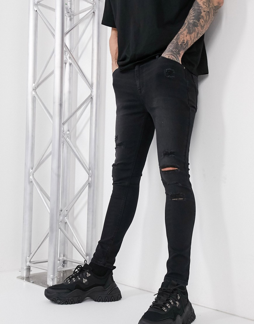 ASOS DESIGN spray on jeans in power stretch with heavy rips in washed black