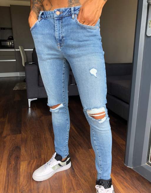 ASOS DESIGN – Spray-on Jeans in verwaschenem Mittelblau im Vintagelook mit Powerstretch und Zierrissen am Knie