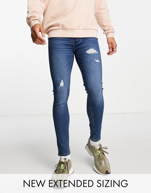 ASOS DESIGN - Spray-on jeans met power stretch, donkerblauwe wassing en slijtage