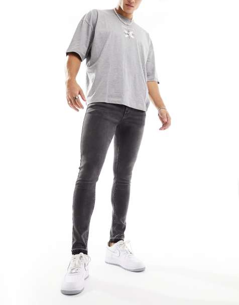 ASOS DESIGN super skinny jeans in washed black with paint splatter