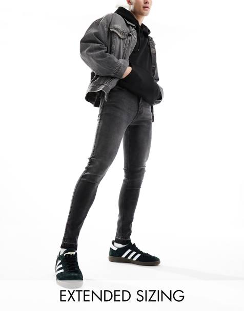 ASOS DESIGN spray on jeans with power stretch and released hem in washed black - view 1