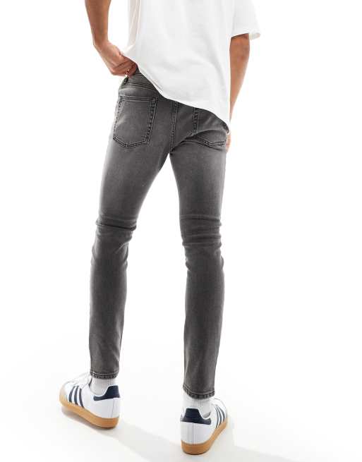 ASOS DESIGN spray on jeans with power-stretch denim with rips and panels in washed black, 2 of 5