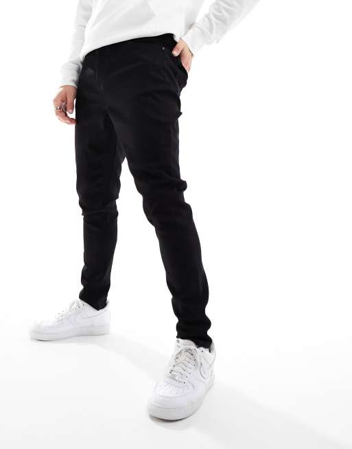 ASOS DESIGN spray on jeans with power stretch in black, 4 of 5